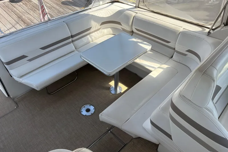 Slide: The Image of 2000 Formula 34 Performance Cruiser interior with white seating and table. - 7