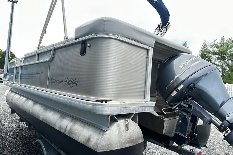 Slide: The Image of 2007 Godfrey Sweetwater Tuscany pontoon boat with Yamaha outboard motor on trailer. - 2