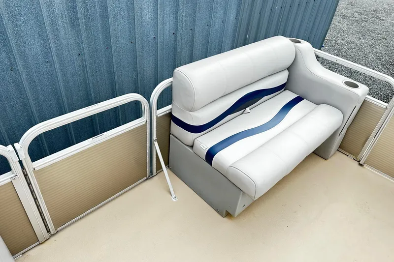 Slide: The Image of 2007 Godfrey Sweetwater Tuscany boat seat with blue accents and cup holders. - 8