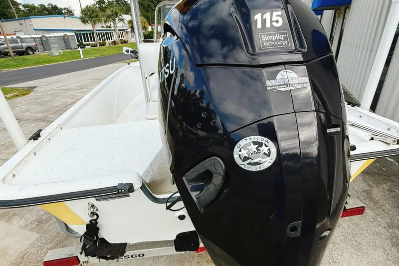 Slide: The Image of 2005 Nitro Bay boat with Tohatsu 115 engine, parked outdoors. - 12