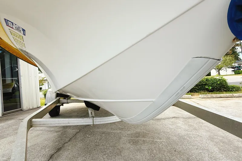Slide: The Image of 2005 Nitro Bay boat on trailer, close-up of hull and trailer frame. - 13