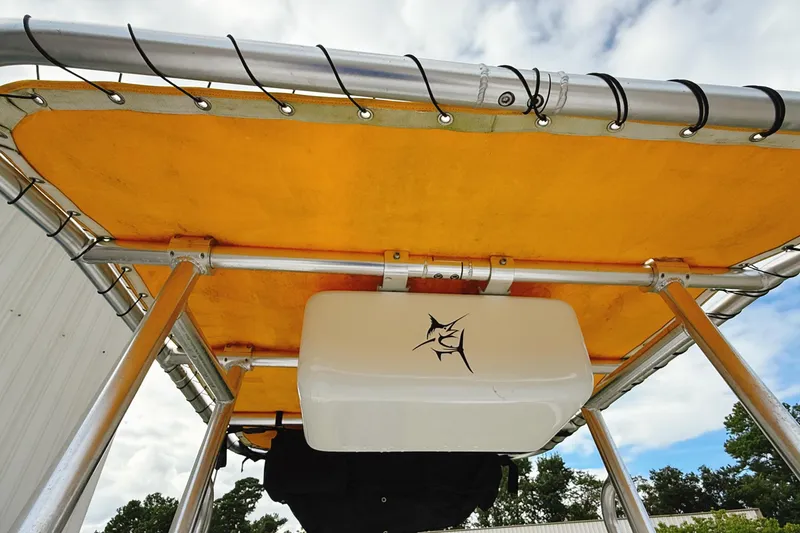 Slide: The Image of 2005 Nitro Bay boat canopy with yellow cover and fishing logo. - 16