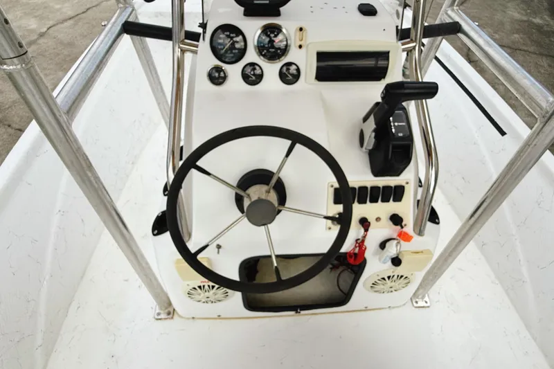 Slide: The Image of 2005 Nitro Bay boat console with steering wheel and control panel. - 9
