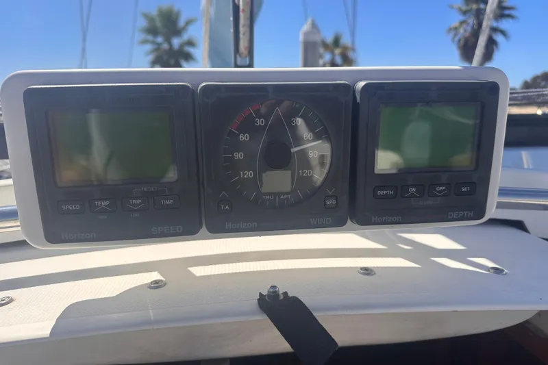 Slide: The Image of Horizon marine instrument panel on a 1978 Pearson 424 sailboat, displaying speed, wind, and depth. - 18