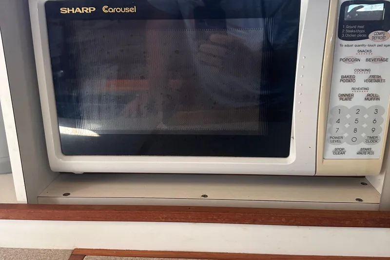 Slide: The Image of Sharp Carousel microwave in a 1978 Pearson 424 sailboat kitchen. - 23