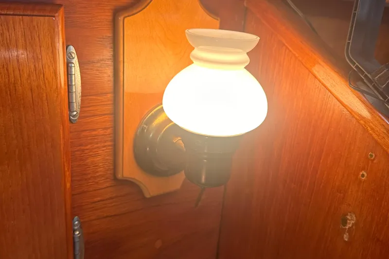 Slide: The Image of Vintage wall-mounted light fixture on 1978 Pearson 424 sailboat interior. - 27