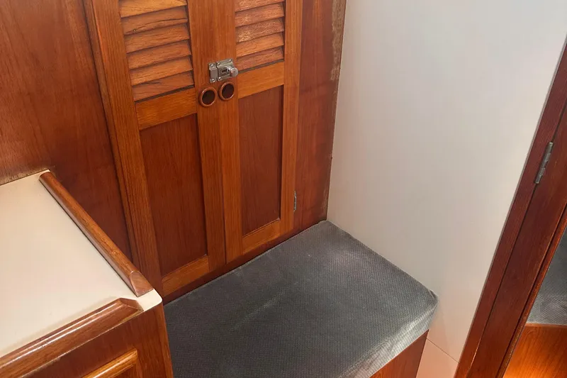 Slide: The Image of 1978 Pearson 424 interior with wooden cabinetry and cushioned seating. - 5