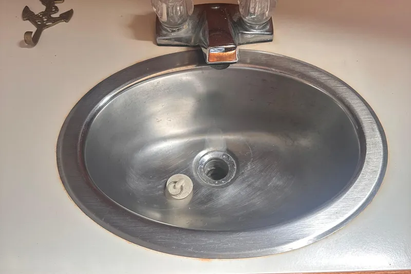 Slide: The Image of Stainless steel sink with dual handles on a Pearson 424, 1978 model. - 6