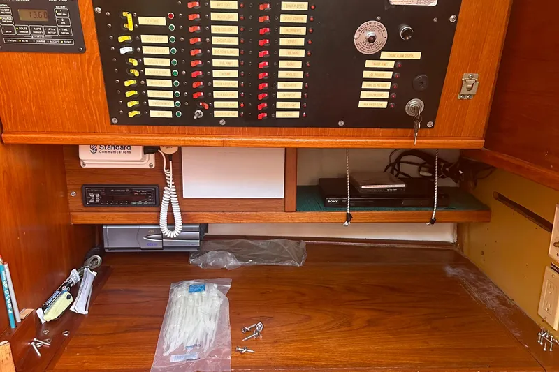 Slide: The Image of Electrical panel and equipment inside a 1978 Pearson 424 sailboat cabin. - 9