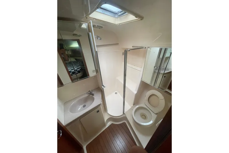 Slide: The Image of Bathroom interior of 1995 Tiara Yachts 4000 Express with shower, sink, and toilet. - 14