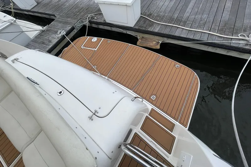 Slide: The Image of 1995 Tiara Yachts 4000 Express docked, with SeaDek synthetic teak decking throughout - 42