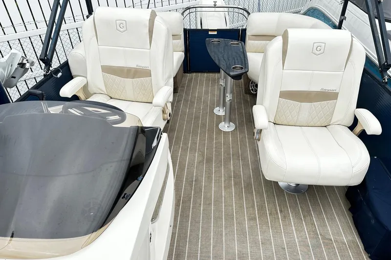 Slide: The Image of Luxurious seating on 2018 Godfrey San Pan Tri Toon boat with cup holders and plush upholstery. - 6