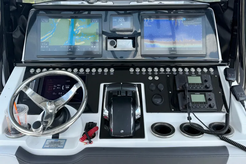 Slide: The Image of 2024 Fountain 34 TE boat dashboard with advanced navigation and control systems. - 12
