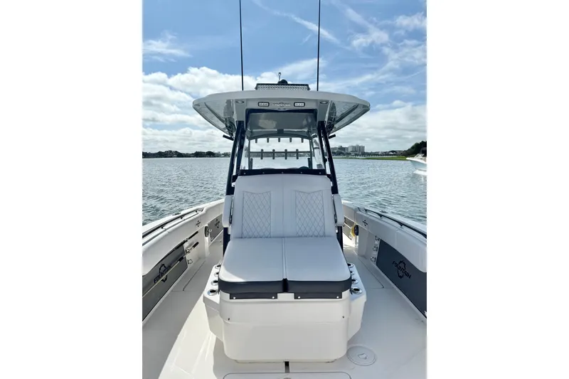 Slide: The Image of 2024 Fountain 34 TE boat on water, featuring sleek seating and modern design. - 14