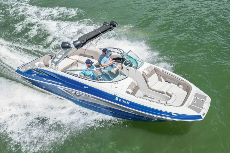 Slide: The Image of 2019 Crownline Eclipse E255 SURF boat cruising on green water. - 7