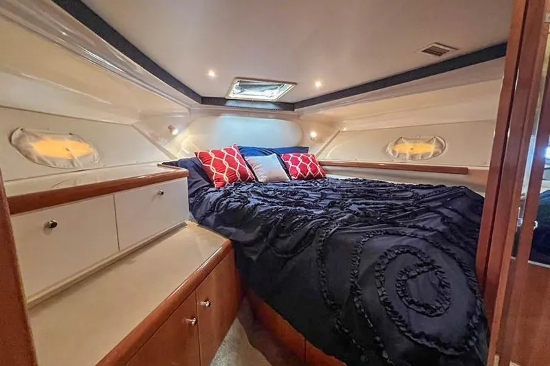 Slide: The Image of Luxurious cabin interior of 2002 Carver 350 Mariner yacht with cozy bedding. - 19