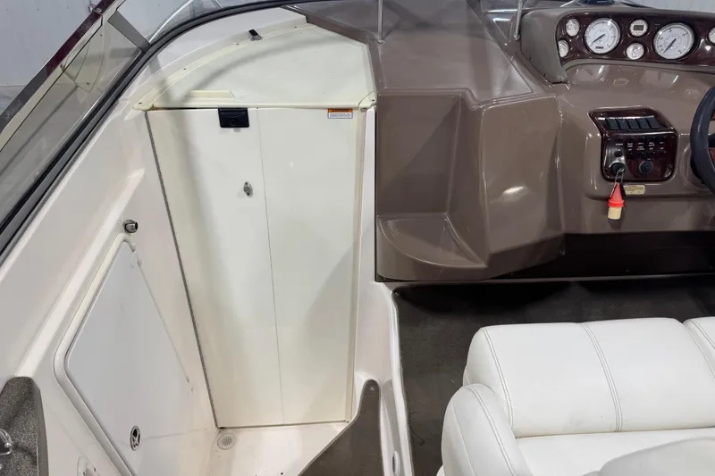 Slide: The Image of 2005 Regal Commodore 2665 boat interior with dashboard and seating area. - 10