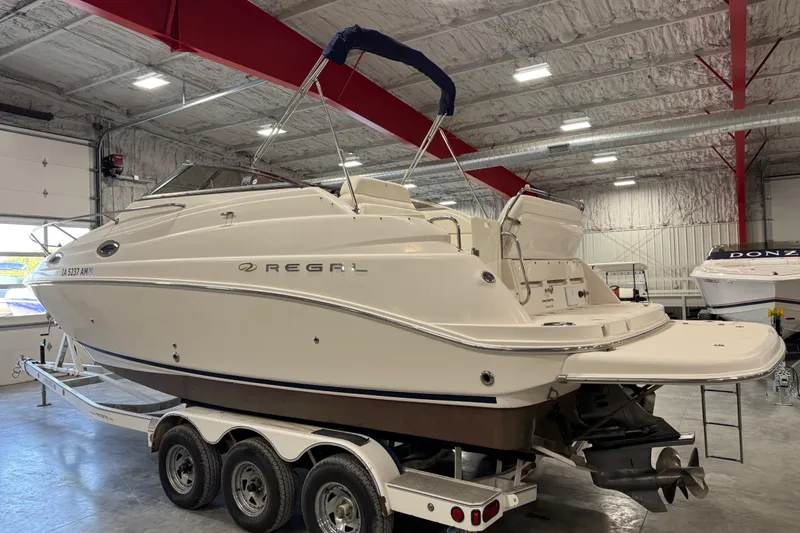 Slide: The Image of 2005 Regal Commodore 2665 boat on trailer in indoor storage facility. - 3