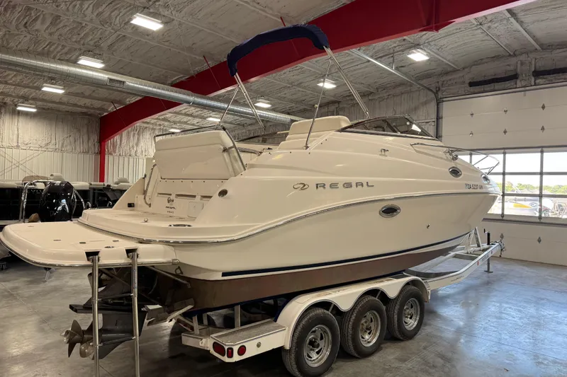 Slide: The Image of 2005 Regal Commodore 2665 boat on trailer in indoor storage facility. - 4