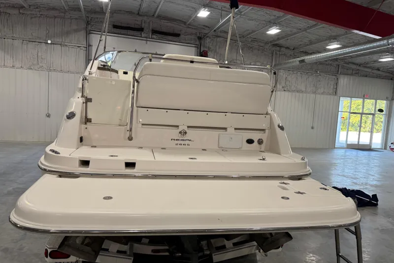 Slide: The Image of 2005 Regal Commodore 2665 boat in a spacious indoor storage facility. - 5