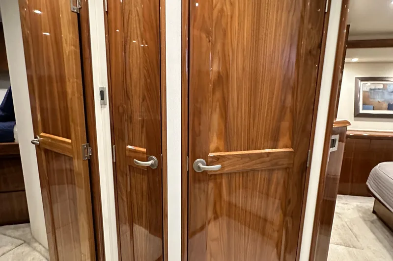 Slide: The Image of Interior of 2017 Viking 55 Convertible yacht with polished wooden doors. - 103