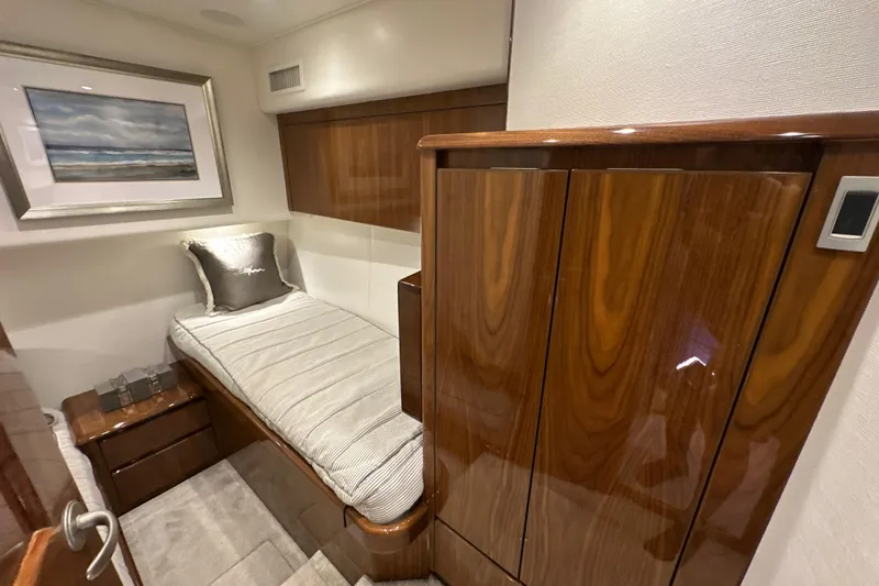 Slide: The Image of Luxurious cabin interior of 2017 Viking 55 Convertible yacht with elegant wood finishes. - 108
