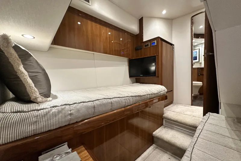Slide: The Image of Luxurious interior of 2017 Viking 55 Convertible yacht with cozy bedding and modern amenities. - 112