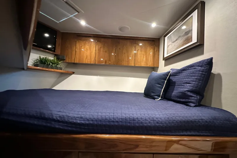 Slide: The Image of Luxurious cabin interior of 2017 Viking 55 Convertible yacht with cozy bedding. - 118