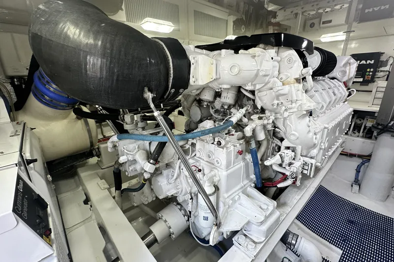 Slide: The Image of Engine room of a 2017 Viking 55 Convertible yacht, showcasing a powerful marine engine. - 132