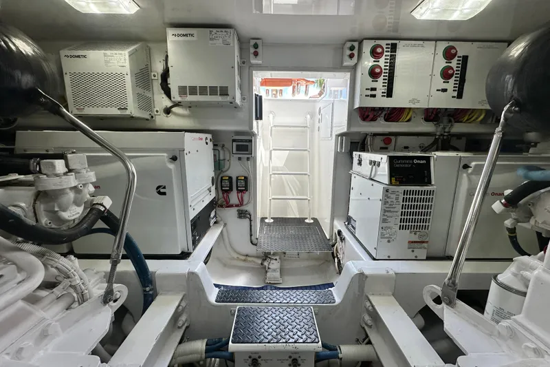 Slide: The Image of Engine room of 2017 Viking 55 Convertible yacht with Cummins Onan generators and Dometic systems. - 134