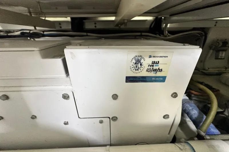 Slide: The Image of Engine room of 2017 Viking 55 Convertible with Seakeeper stabilizer unit. - 141