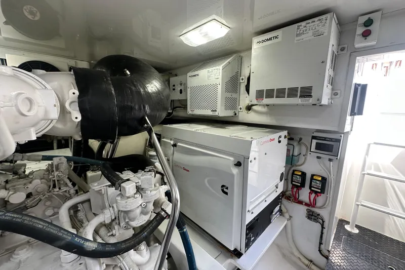 Slide: The Image of Engine room of 2017 Viking 55 Convertible yacht with Cummins Onan generator and Dometic equipment. - 143