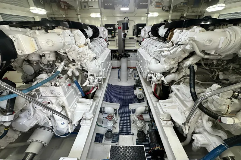 Slide: The Image of Engine room of a 2017 Viking 55 Convertible yacht, featuring dual MAN engines. - 147