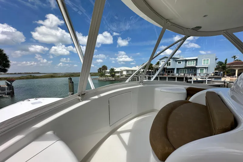 Slide: The Image of 2017 Viking 55 Convertible yacht interior with waterfront view and modern homes. - 36