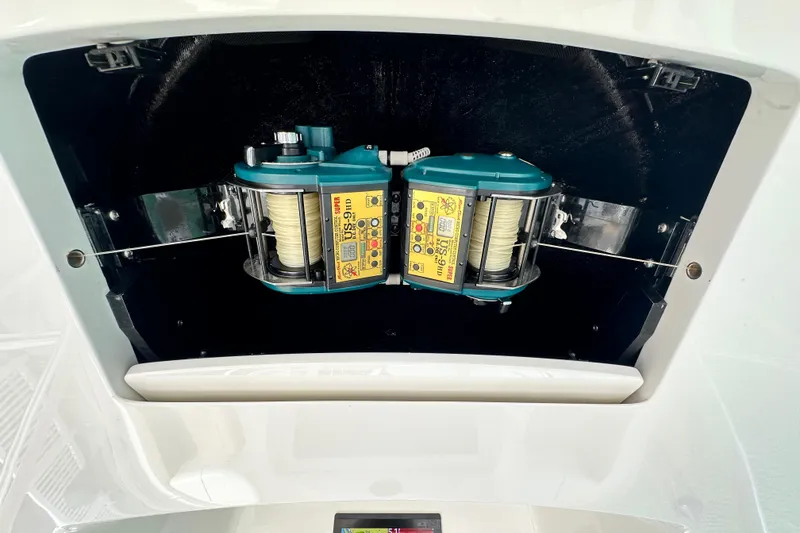 Slide: The Image of 2017 Viking 55 Convertible fishing reel compartment with dual electric reels. - 38