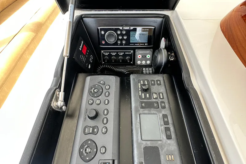 Slide: The Image of Control panel of 2017 Viking 55 Convertible yacht with advanced navigation and communication systems. - 43