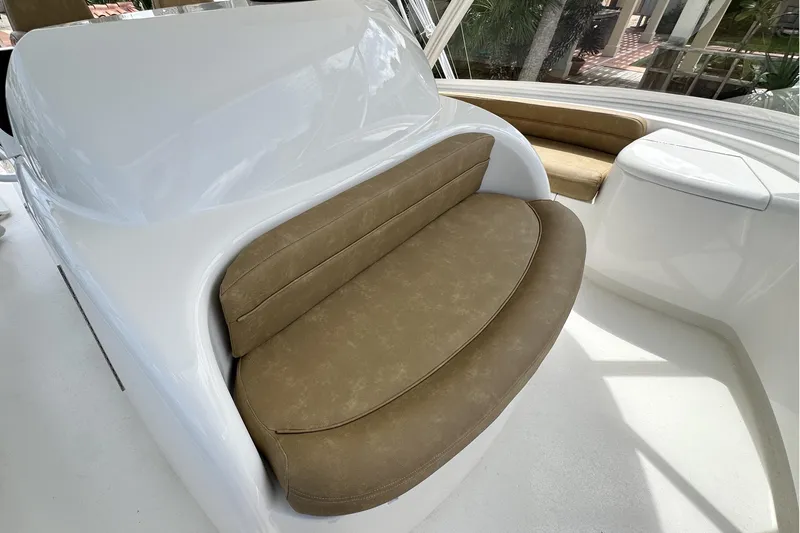 Slide: The Image of Luxurious seating on 2017 Viking 55 Convertible yacht, featuring elegant brown upholstery. - 47