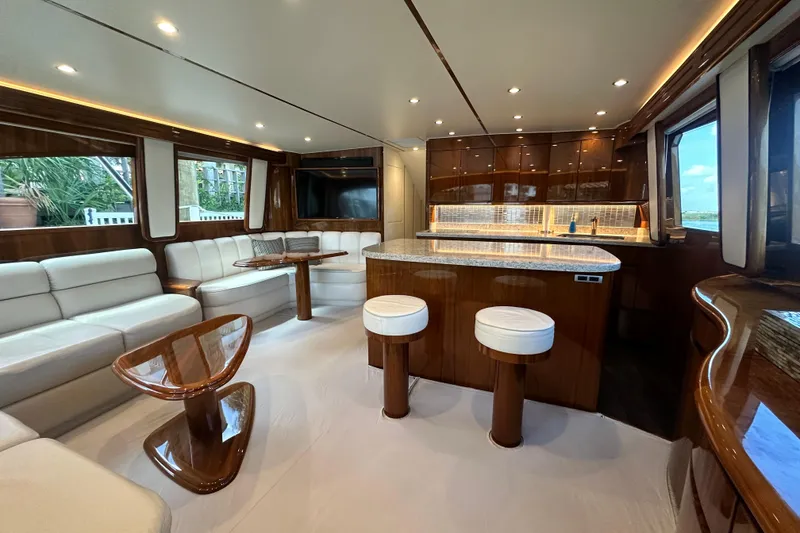 Slide: The Image of Luxurious interior of 2017 Viking 55 Convertible yacht with elegant seating and modern kitchen. - 60