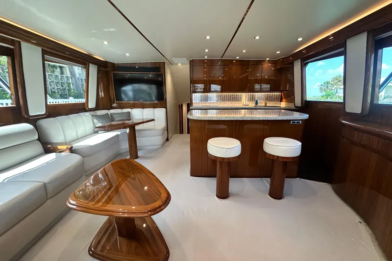 Slide: The Image of Luxurious interior of 2017 Viking 55 Convertible yacht with elegant seating and modern kitchen. - 62