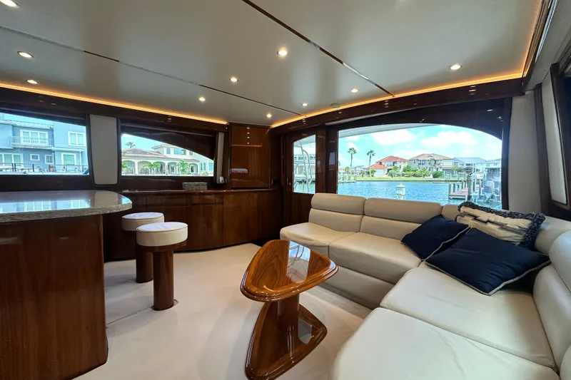 Slide: The Image of Luxurious interior of 2017 Viking 55 Convertible yacht with elegant seating and waterfront view. - 64