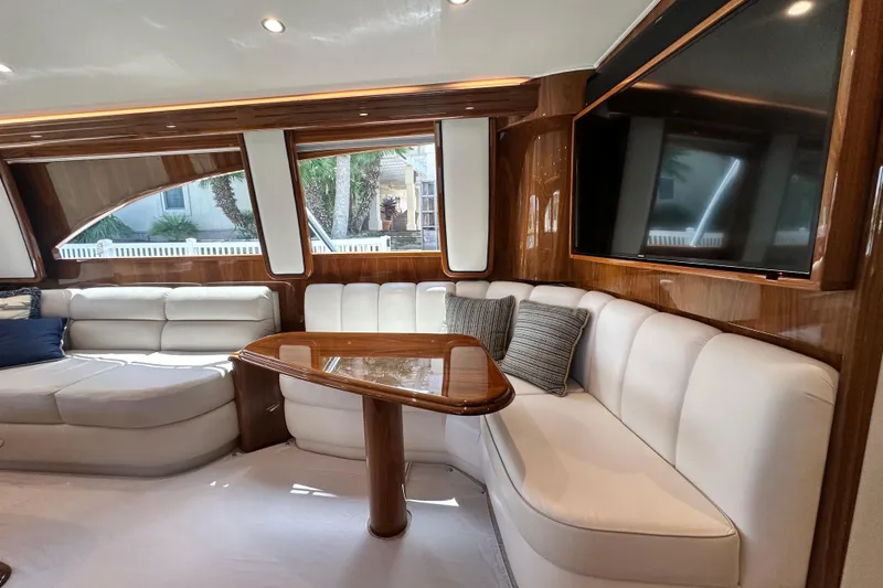 Slide: The Image of Luxurious interior of 2017 Viking 55 Convertible yacht with plush seating and elegant wood finishes. - 67