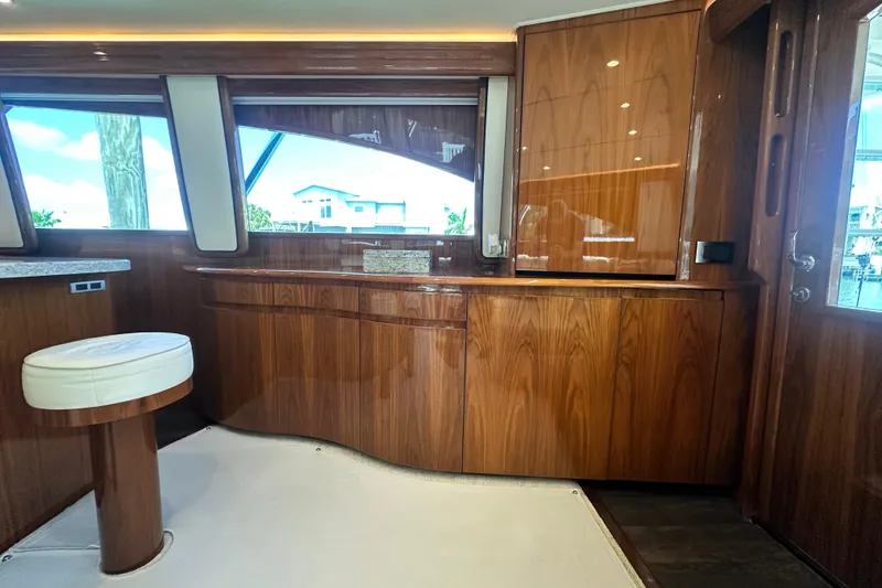 Slide: The Image of Luxurious interior of 2017 Viking 55 Convertible yacht with polished wood cabinetry. - 71