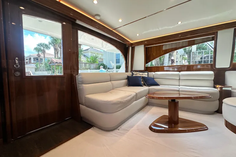 Slide: The Image of Luxurious interior of 2017 Viking 55 Convertible yacht with plush seating and elegant wood finishes. - 74