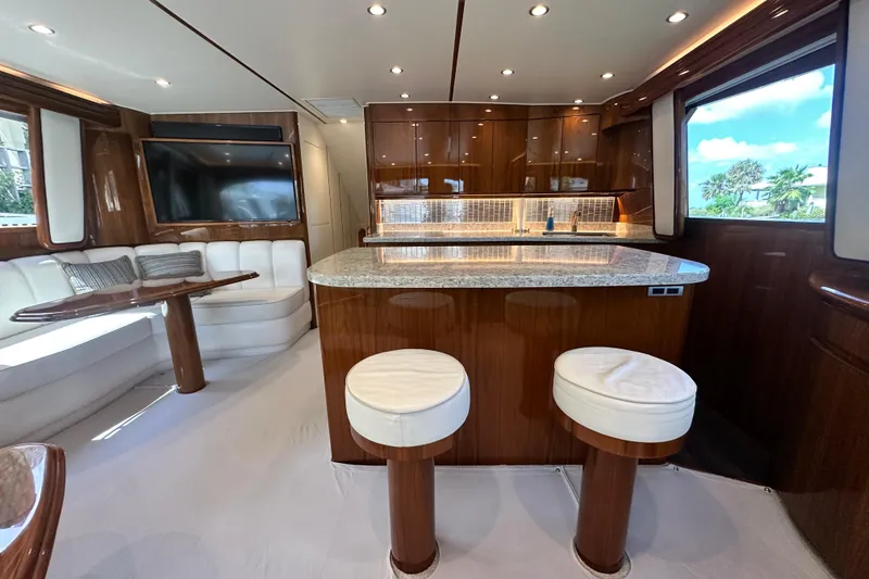 Slide: The Image of Luxurious interior of 2017 Viking 55 Convertible yacht with modern kitchen and seating area. - 75