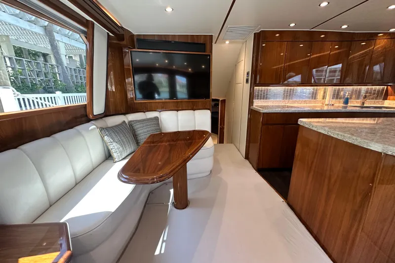 Slide: The Image of Luxurious interior of 2017 Viking 55 Convertible yacht with elegant seating and modern kitchen. - 77