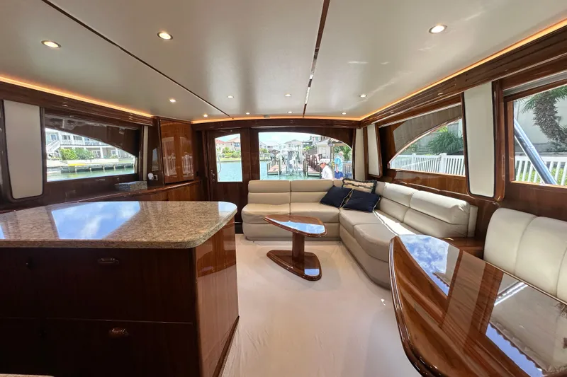 Slide: The Image of Luxurious interior of 2017 Viking 55 Convertible yacht with elegant seating and wood finishes. - 79