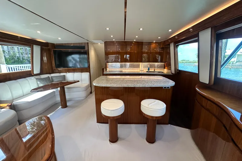 Slide: The Image of Luxurious interior of 2017 Viking 55 Convertible yacht with elegant seating and modern kitchen. - 80
