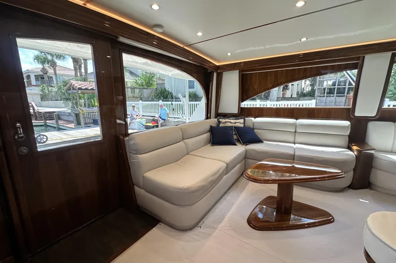 Slide: The Image of Luxurious interior of 2017 Viking 55 Convertible yacht with plush seating and elegant wood finishes. - 82