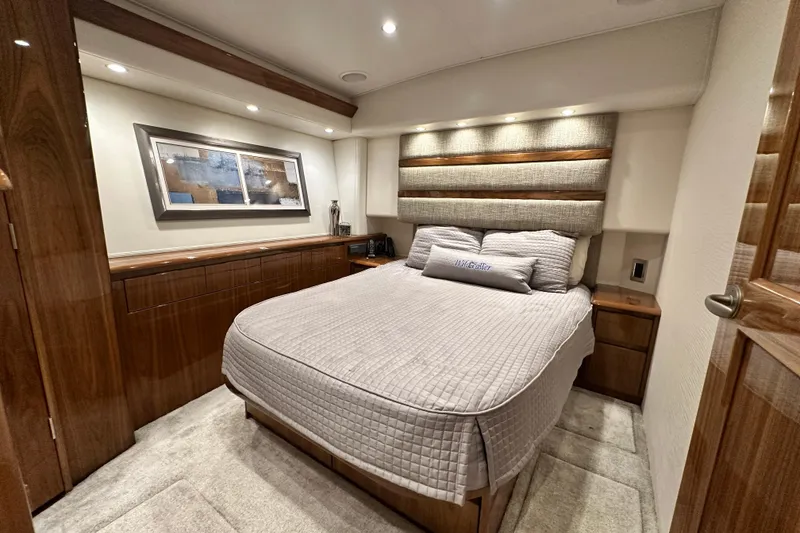 Slide: The Image of Luxurious bedroom interior of 2017 Viking 55 Convertible yacht with elegant wood finishes. - 89