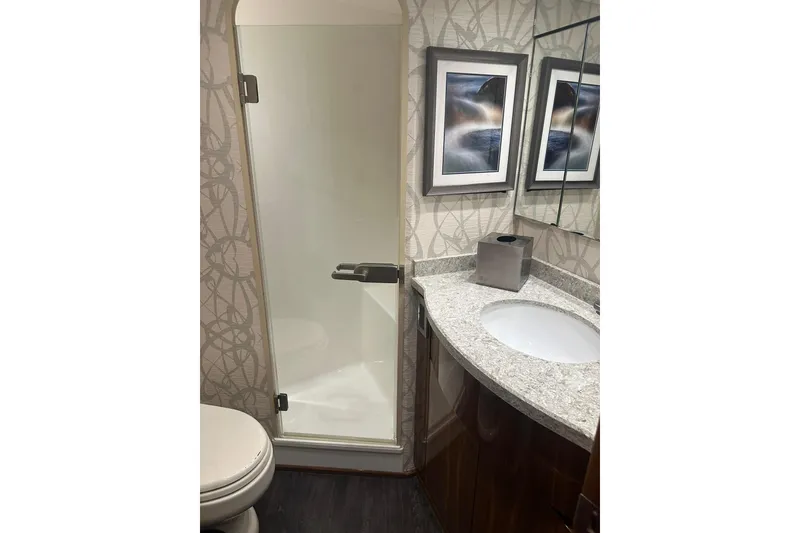 Slide: The Image of Bathroom interior of 2017 Viking 55 Convertible yacht with shower and modern decor. - 94